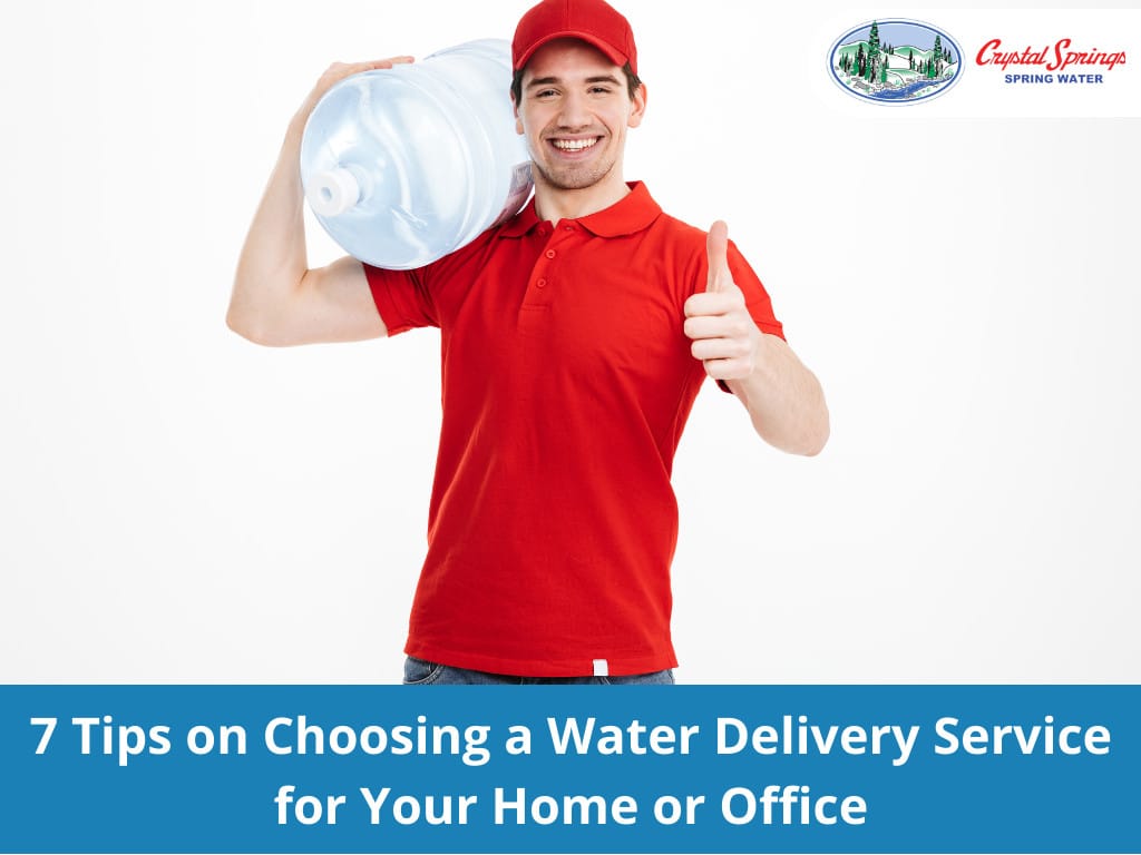 Image of smiling bottled water delivery courier in red t-shirt